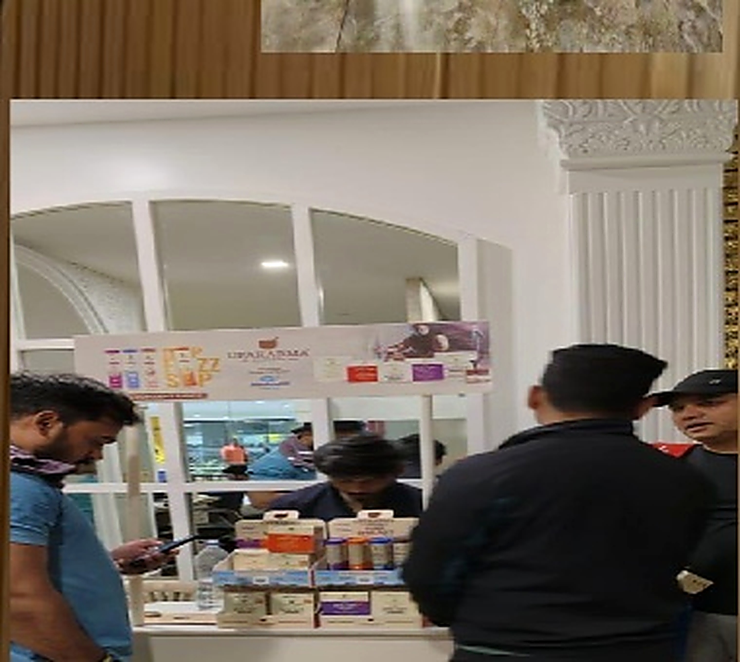 Members interacting at sampling booth
